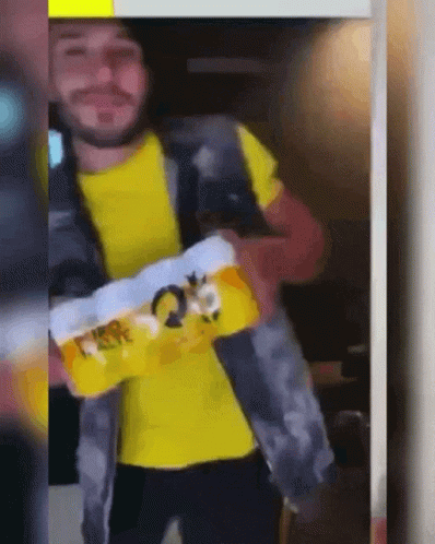 Man In Yellow Shirt Holding Toilet Paper GIF