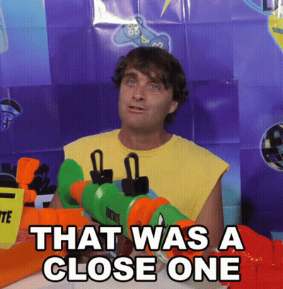 Man In Yellow Shirt Holding Water Gun That Was A Close One GIF