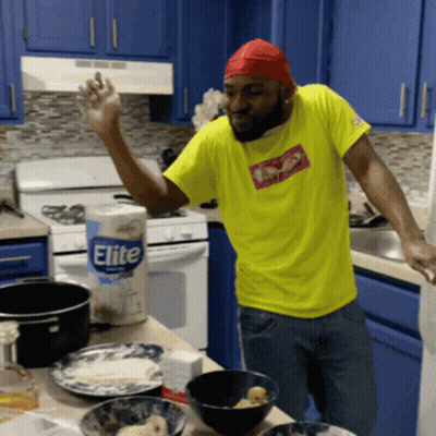Man In Yellow Shirt In Kitchen GIF