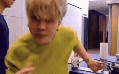 Man In Yellow Shirt In Kitchen With Coffee Cup GIF