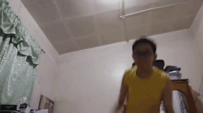 Man In Yellow Shirt Jumping GIF