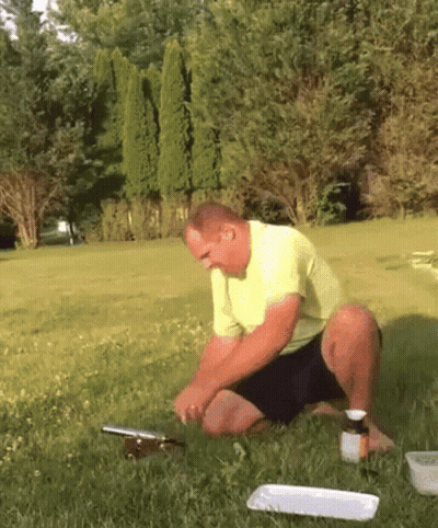Man In Yellow Shirt Kneeling With Medicine GIF