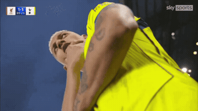 Man In Yellow Shirt Looking At Sky Sports Logo GIF