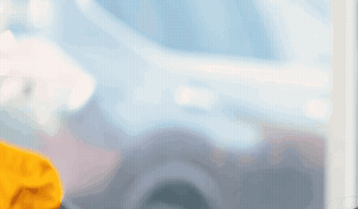 Man In Yellow Shirt Looking Out Window GIF