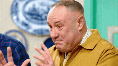 Man In Yellow Shirt Making Face GIF