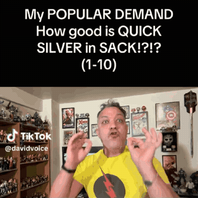 Man In Yellow Shirt Making Funny Face In Front Of Action Figures GIF