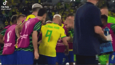 Man In Yellow Shirt Next To Man In Red GIF