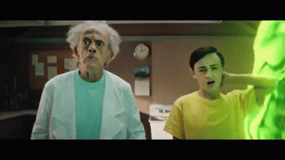 Man In Yellow Shirt Next To Older Man In White Coat GIF