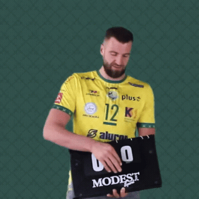Man In Yellow Shirt Number 12 Holding Scoreboard GIF