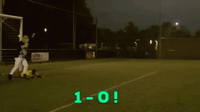 Man In Yellow Shirt Number 12 Holding Scoreboard GIF