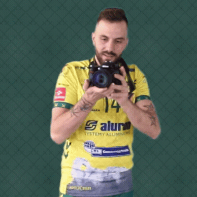 Man In Yellow Shirt Number 14 Taking Selfie GIF
