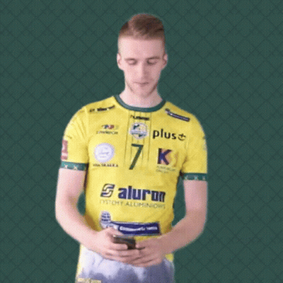 Man In Yellow Shirt Number 7 Looking At Phone GIF