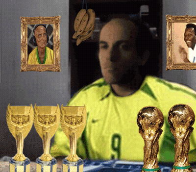 Man In Yellow Shirt Number 9 Surrounded By Trophies GIF