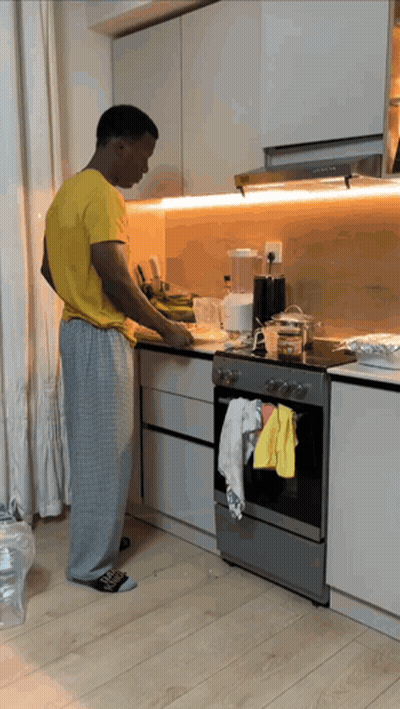 Man In Yellow Shirt Preparing Food GIF