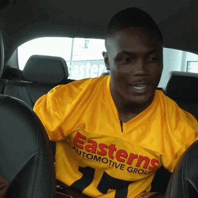 Man In Yellow Shirt Saying Easterns Automotive Group GIF