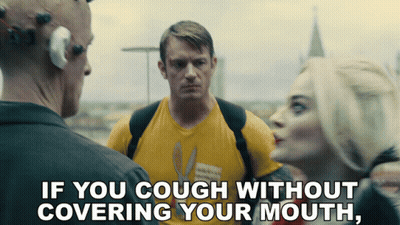 Man In Yellow Shirt Saying If You Cough Without Covering Mouth GIF