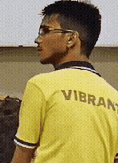 Man In Yellow Shirt Saying Vibrant GIF