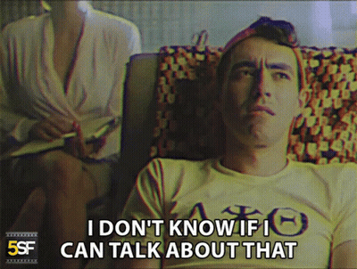 Man In Yellow Shirt Says I Don't Know If I Can Talk About That GIF