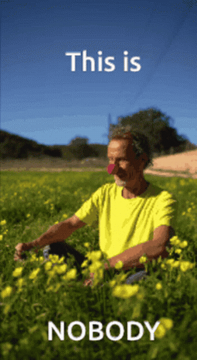 Man In Yellow Shirt Sitting In Yellow Flowers This Is Nobody GIF