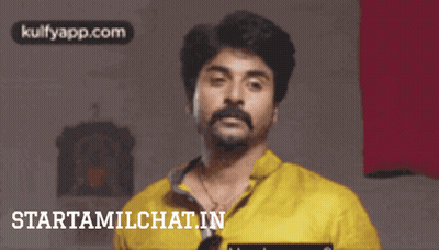 Man In Yellow Shirt Smiling GIF
