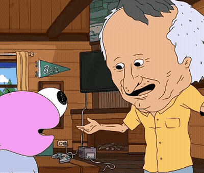 Man In Yellow Shirt Talking To Cartoon Character Under Bois Banner GIF