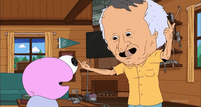 Man In Yellow Shirt Talking To Cartoon Character GIF