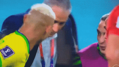 Man In Yellow Shirt Talking To Soccer Player GIF