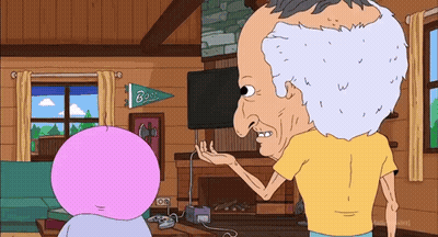 Man In Yellow Shirt Talking Under Bass Banner GIF