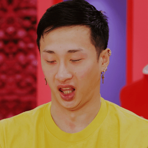 Man In Yellow Shirt With Key Earring GIF