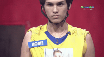 Man In Yellow Shirt With Kobie Tag GIF
