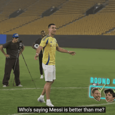 Man In Yellow Shirt With Letter J Kicks Soccer Ball GIF
