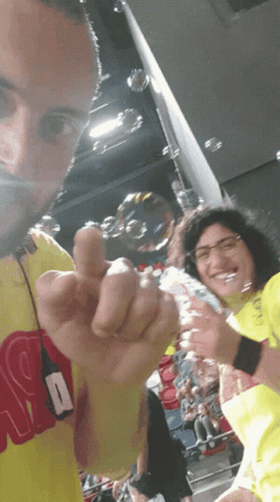 Man In Yellow Shirt With R Giving Middle Finger GIF