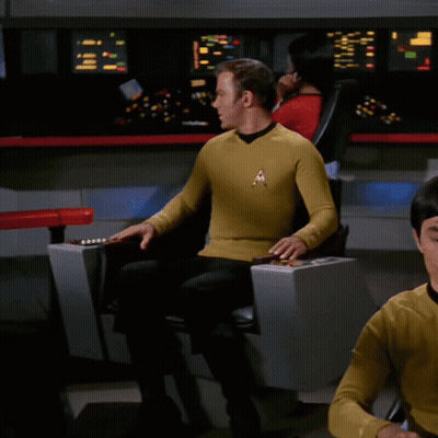 Man In Yellow Shirt With Star Trek Badge GIF
