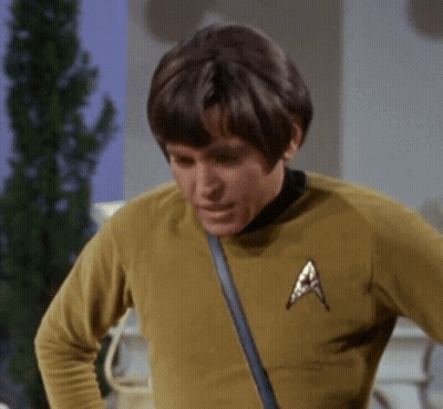 Man In Yellow Shirt With Star Trek Badge GIF