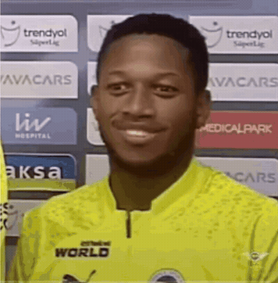 Man in Yellow Shirt With World Smiling