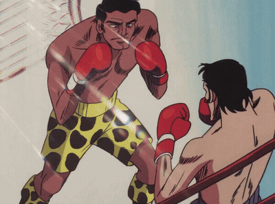 Man in Yellow Shorts Boxing Man in Red Gloves