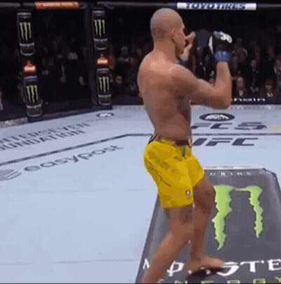 Man In Yellow Shorts Standing In Front Of Monster Energy Can GIF