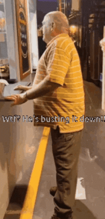 Man In Yellow Striped Shirt Standing Next To Yellow Line GIF