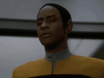 Man In Yellow Suit And Black Hat GIF