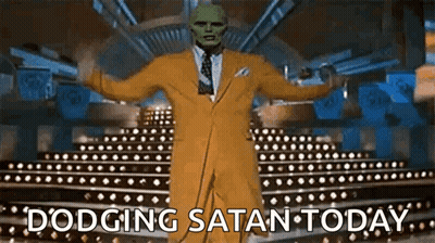 Man In Yellow Suit And Green Mask Dodging Satan Today GIF