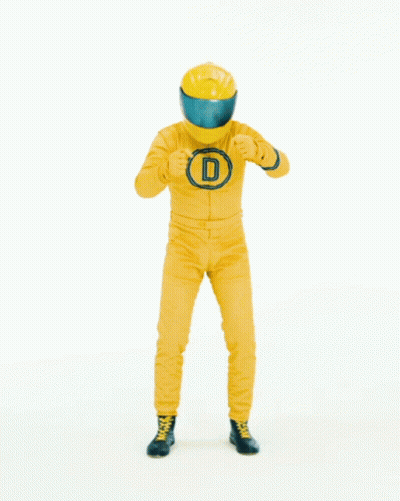 Man in Yellow Suit and Helmet in Front of Sign Saying Und Abfahrt