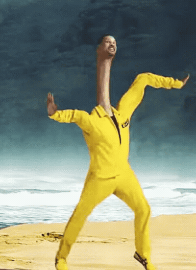 Man In Yellow Suit Dancing On Beach GIF