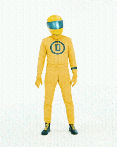 Man in Yellow Suit Making Heart Shape Saying Love It