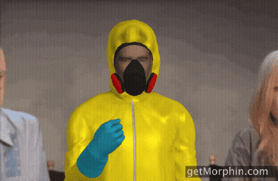 Man In Yellow Suit With Gas Mask And Blue Gloves At Getmorphin.com GIF