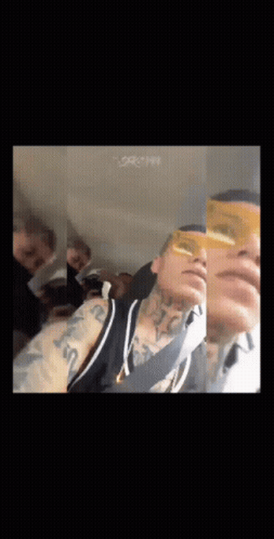 Man In Yellow Sunglasses Taking Selfie In Car With Group GIF