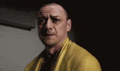 Man In Yellow Sweater And Scarf Making Funny Face GIF