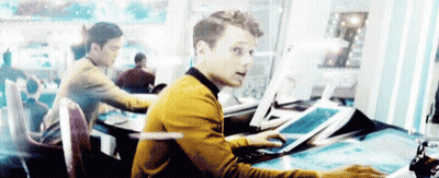 Man In Yellow Sweater At Desk With Computer GIF