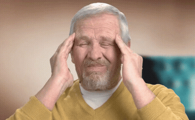 Man In Yellow Sweater Hands On Head Eyes Closed GIF