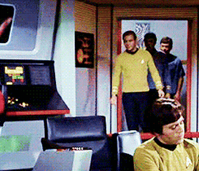 Man In Yellow Sweater Sitting In Chair GIF
