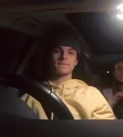 Man In Yellow Sweatshirt Driving Car GIF